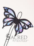 The large size butterfly costume wings sit on a white background. A loop at the top goes over the dogs head allowing the wings to sit over the dogs shoulders or wherever you think it looks best. The tails of the loop allow the head loop to be pulled longer or shorter and can then be tied under the dogs belly, or around its harness.