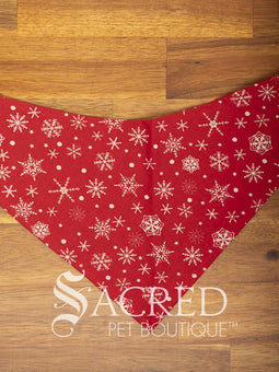 Dog wearing a purple poppy patterned ANZAC memorial bandana with 'Sacred Pet Boutique' logo.