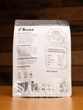 A packet of Freeze dried Tasmanian possum meat sits on a wooden table with a wood plank background. Information shown includes feeding guidelines, nutritional analysis and ingredients.