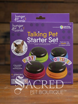 Talking Pet Starter Set packaging with colourful buttons on a wooden surface, branded by Sacred Pet Boutique.
