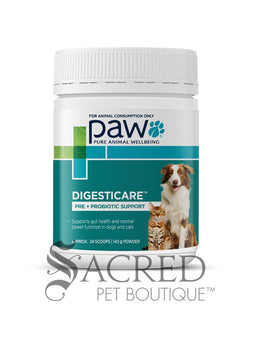 A white plastic bottle of Paw Pure Animal Wellbeing Digesticare pre and probiotic support powder for pets, featuring a teal and green label with an image of a dog and cat, on a white background with a 'Sacred Pet Boutique' watermark at the bottom.