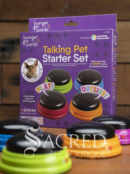 Talking Pet Starter Set packaging with colourful buttons on a wooden surface, branded by Sacred Pet Boutique.