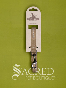 The Catventure logo and recycled image is shown on the black leash near the stainless steel snap hook end of the leash. The leash is shown looped and on a white background.