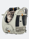 Cat in an Ibiyaya Adventure cat Pet carrier with a visible Sacred Pet Boutique watermark on a white background