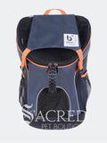 A navy blue pet carrier backpack with black mesh side pockets and bright orange accents, featuring a white brand label on the top flap and a prominent 'Sacred Pet Boutique' watermark at the bottom.