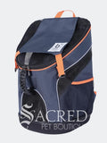 A navy blue pet backpack with orange accents, shown against a light grey background. The brand 'Sacred Pet Boutique' is visible as a watermark overlay at the bottom.