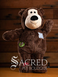 Two plush bears with a wooden background and 'Sacred Pet Boutique' branding.