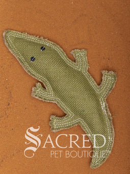 Kevin the Koala is a jute dog toy with wool felt detail and multiple rows of stitching, on a wooden background. A white Sacred Pet Boutique watermark.