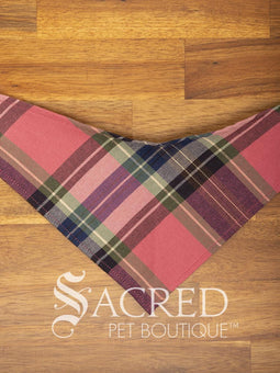 Dog wearing a purple poppy patterned ANZAC memorial bandana with 'Sacred Pet Boutique' logo.