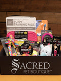 The gift pack is shown opened with the full selection of products on show. All pink or pink based items for female puppies.
