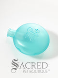 A translucent light blue pet replacement squeaker with an embossed paw print and 'ZP' logo, shown on a white background with the Sacred Pet Boutique logo at the bottom.