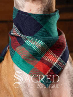 Dog wearing a purple poppy patterned ANZAC memorial bandana with 'Sacred Pet Boutique' logo.