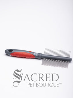 From Yours Droolly, the Shear Magic Long Coat Rake is in it's packaging showing an afghan hound. The rake has a double row of spinning teeth and a red and grey handle. A Sacred Pet Boutique watermark in grey print.