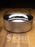 A beautifully styled straight sided double walled steel bowl with brand name ZEEZ etched on the outer brushed finished edge shows the highly polished inner where the brand name is embossed on the base.