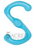 A bright pastel blue dog toy in a distinctive S shape and has a slightly textured, matte finish and includes a small circular emblem stamped in the centre with a dog paw print. It's lying on a white background with a grey Sacred Pet Boutique watermark at the bottom of the image. 