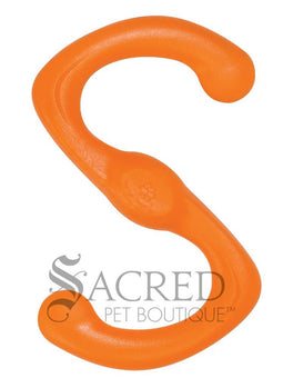 Two dogs running and playing with a green floating toy in an outdoor grassy area. With a grey Sacred Pet Boutique watermark.