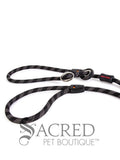 A black/grey rope leash with a metal slider and rubber stoppers, Ezydog Luca leash can be used as a "slip" leash. White background with 'SACRED PET BOUTIQUE' watermark.