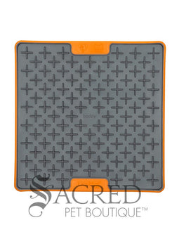 Three LickiMat Tuff Buddy mats in three different colours - orange, green and blue. They're on a white background and has a grey Sacred Pet Boutique watermark. 