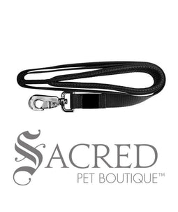 A black padded handle 183cm long leash with a heavy duty metal snap clip. With our comfort leashes, you'll feel less fatigued and be able to focus on enjoying your walk rather than the pain in your hands. Image on white background and 'SACRED PET BOUTIQUE' watermark.