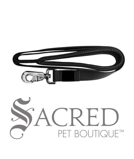 A black padded handle 183cm long leash with a heavy duty metal snap clip. With our comfort leashes, you'll feel less fatigued and be able to focus on enjoying your walk rather than the pain in your hands. Image on white background and 'SACRED PET BOUTIQUE' watermark.